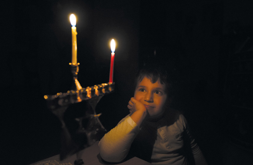  THERE I was, lighting my little candle; Illustrative. (photo credit: MILA AVIV/FLASH90)