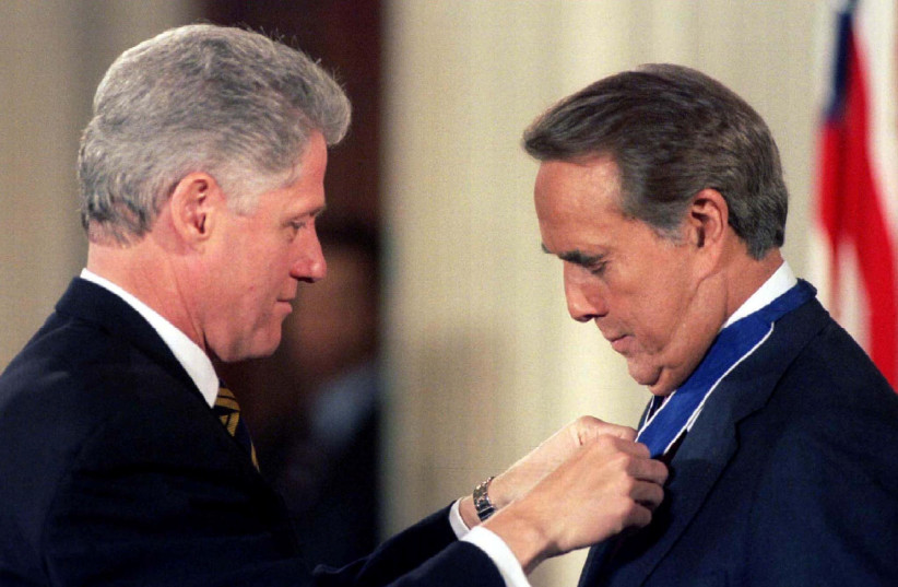  President Bill Clinton pins the Presidential Medal of Freedom, the nation's highest civilian award, on former Senator Bob Dole, January 17, 1997 (credit: REUTERS)