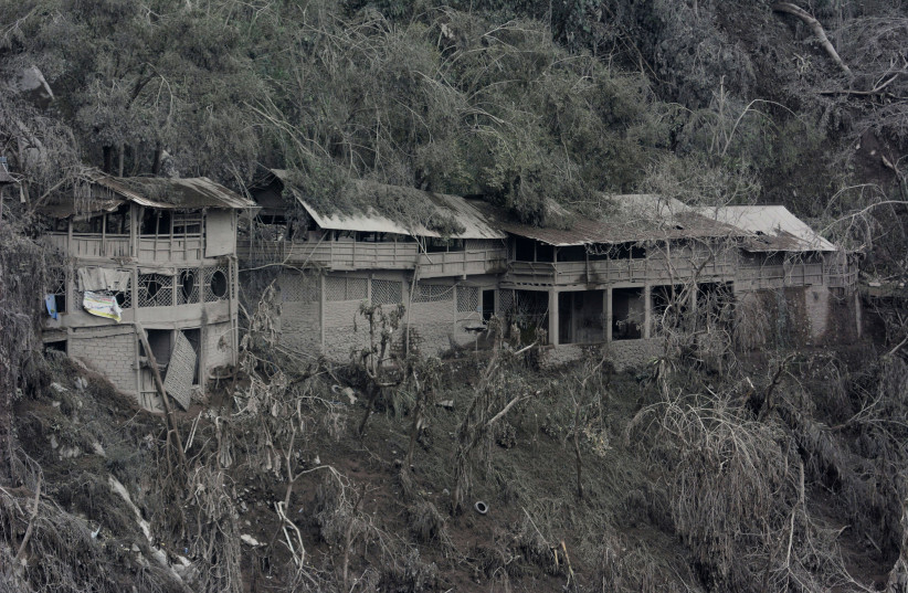  Damaged houses affected by the eruption of Mount Semeru volcano are seen in Pronojiwo village, Lumajang, East Java province, Indonesia December 6, 2021 (credit: ANTARA FOTO/SENO/VIA REUTERS)