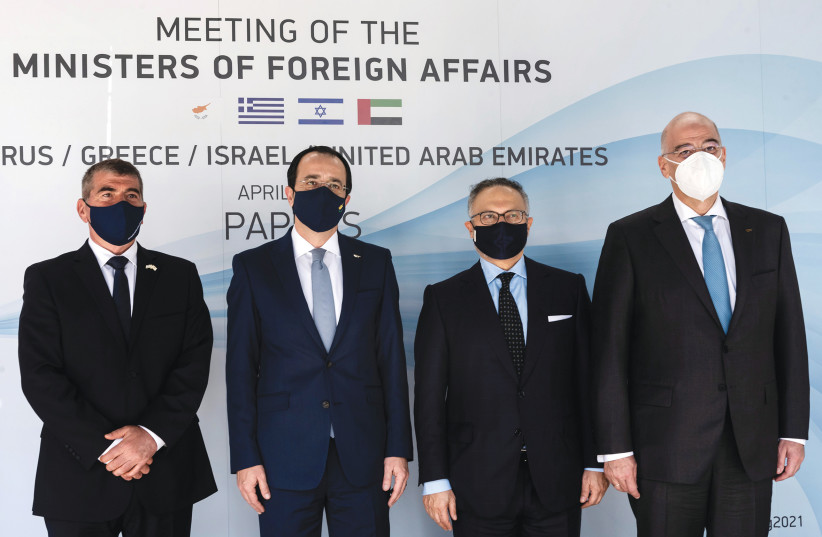  FOREIGN MINISTERS of Israel, Cyprus and Greece and a UAE presidential diplomatic adviser meet in Paphos, Cyprus in April. (photo credit: LAKOVOS HATZISTAVROU/REUTERS)
