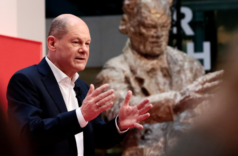  Germany's Social Democratic Party (SPD) candidate for chancellor Olaf Scholz attends a hybrid party conference for the approval of the traffic light coalition agreement at the party headquarters in Berlin, Germany, December 4, 2021 (credit: REUTERS)