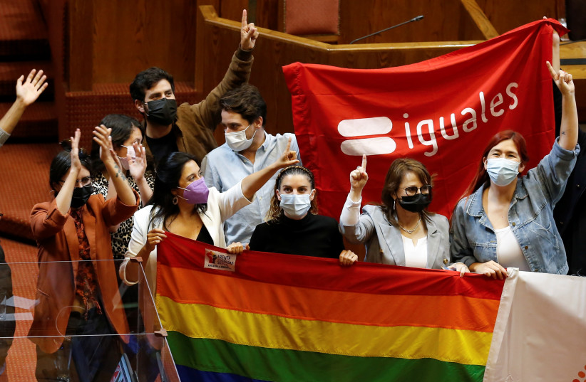 People react at the Chamber of Deputies as the Senate vote to approve a same-sex marriage bill in Valparaiso, Chile December 7, 2021 (photo credit: REUTERS/RODRIGO GARRIDO)