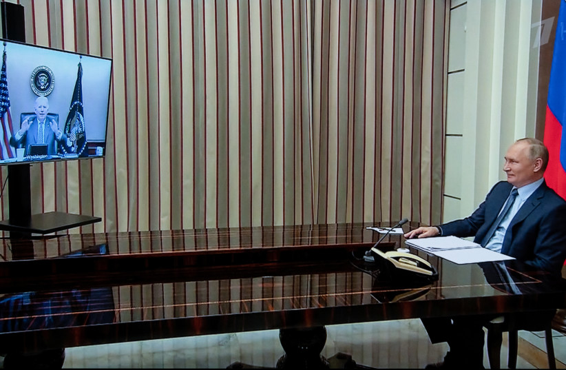 Russian President Vladimir Putin holds talks with US President Joe Biden via a video link in Sochi, Russia, December 7, 2021. (photo credit: SPUTNIK/SERGEI GUNEEV/KREMLIN VIA REUTERS)