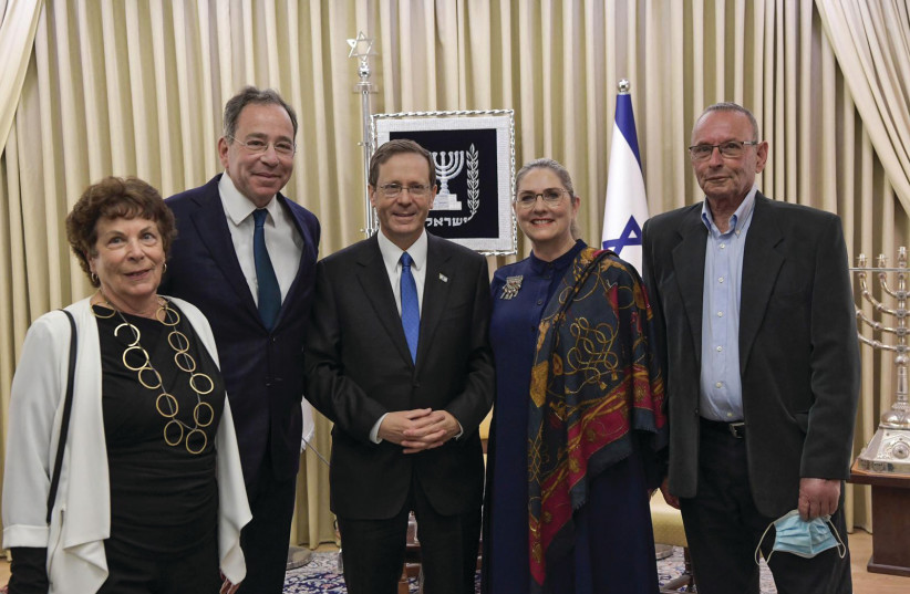  PRESIDENT ISAAC HERZOG and his wife, Michal, flanked by Elie Alon (left), alongside US Ambassador Tom Nides, to whom she taught Hebrew when he was 13 years old, and Giora Alon. (photo credit: KOBI GIDEON/GPO)