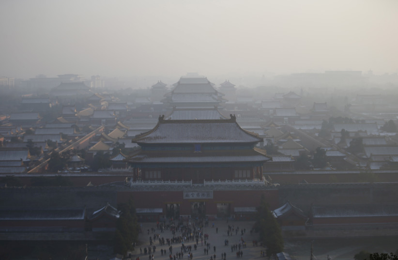  The Forbidden City is seen from the top of Jingshan Park during a heavily polluted day in Beijing, China, November 29, 2015. Beijing plans to ramp up its already tough car emission standards by 2017 in a bid by one of the world's most polluted cities to improve its often hazardous air quality. (credit: KIM KYUNG-HOON/FILE PHOTO/ REUTERS)