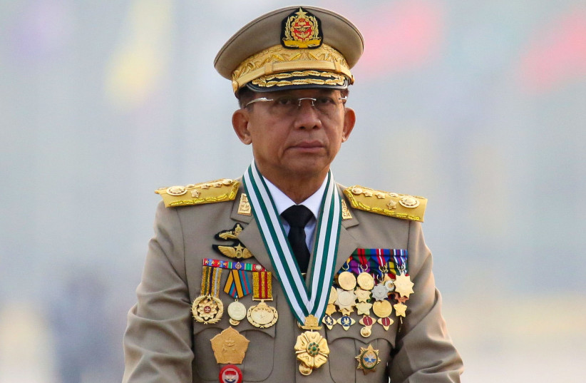 Myanmar's junta chief Senior General Min Aung Hlaing, who ousted the elected government in a coup on February 1, presides an army parade on Armed Forces Day in Naypyitaw, Myanmar, March 27, 2021. (photo credit: REUTERS/STRINGER/FILE PHOTO)
