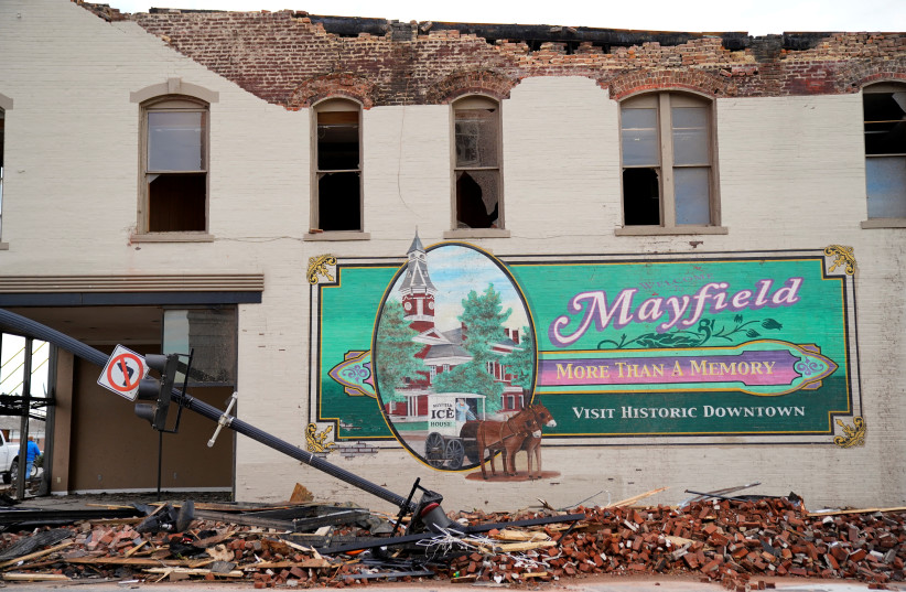  A general view of a sign welcoming visitors to the town of Mayfield after a devastating outbreak of tornadoes ripped through several US states, in Mayfield, Kentucky (credit: REUTERS/Cheney Orr)