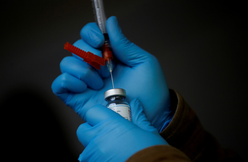  At a free drive-through coronavirus disease (COVID-19) vaccine clinic run by the Jamestown S'Klallam Tribe in Sequim (photo credit: REUTERS/LINDSEY WASSON)
