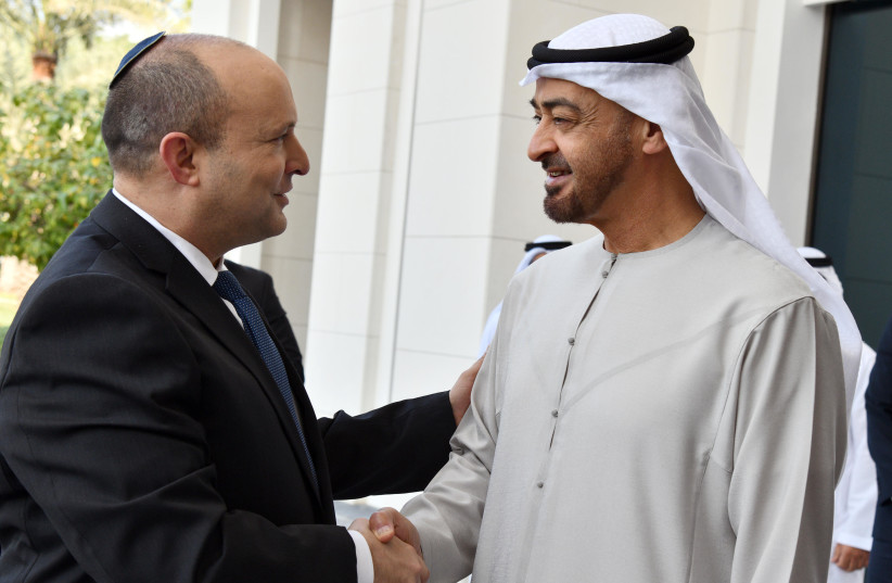 Naftali Bennett shakes hands with the UAE’s leader Crown Prince of Abu Dhabi Sheikh Mohammed bin Zayed Al Nahyan. (credit: HAIM ZACH/GPO)