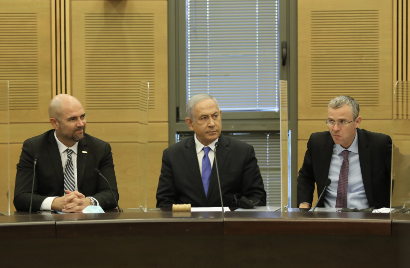Likud MKs Amir Ohana, opposition head Benjamin Netanyahu and Yariv Levin at the Knesset, December 13, 2021.  (credit: MARC ISRAEL SELLEM/THE JERUSALEM POST)