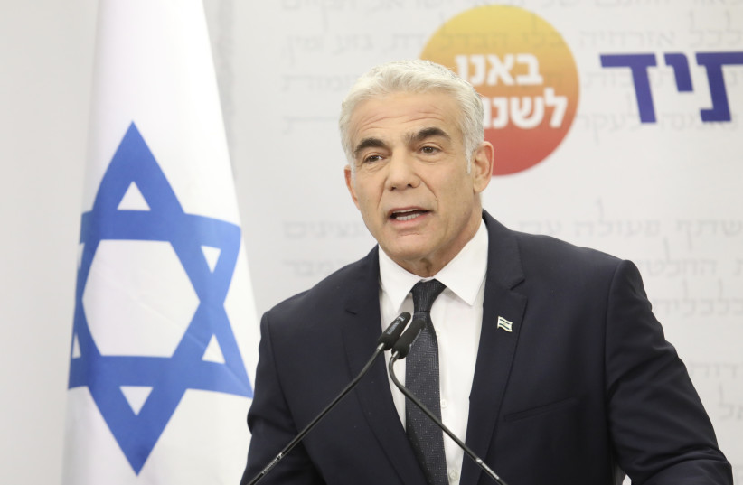  Foreign Minister and Yesh Atid head Yair Lapid at his faction's meeting, December 13, 2021. (credit: MARC ISRAEL SELLEM/THE JERUSALEM POST)