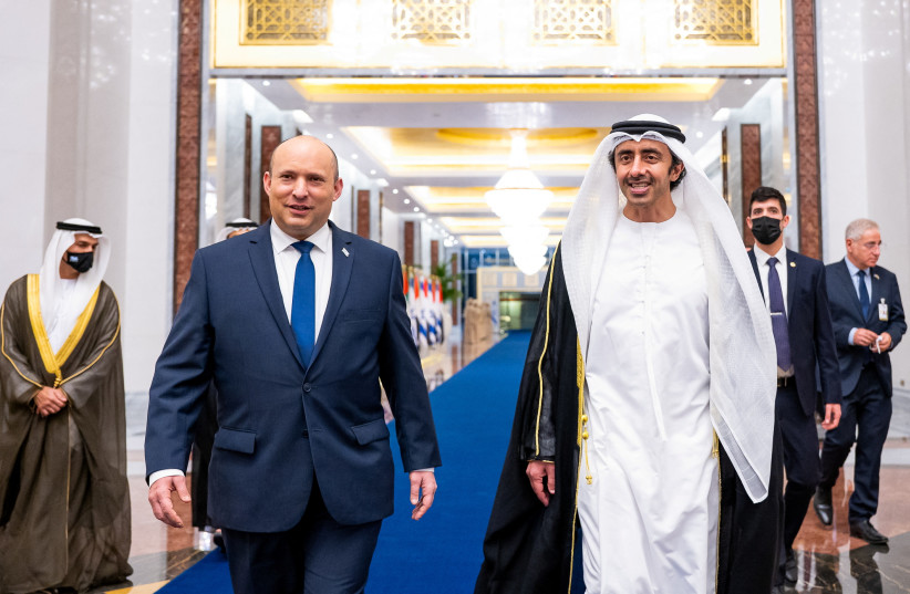  United Arab Emirates Foreign Minister Sheikh Abdullah bin Zayed Al Nahyan welcomes Israeli Prime Minister Naftali Bennett upon his arrival in Abu Dhabi (photo credit: REUTERS)