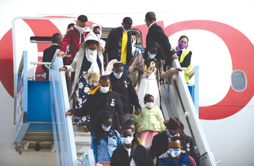  ETHIOPIANS ARRIVE on aliyah at Ben-Gurion Airport earlier this year. Ethiopian aliyah constitutes a crucial moral issue for the Jewish people. (photo credit: TOMER NEUBERG/FLASH90)