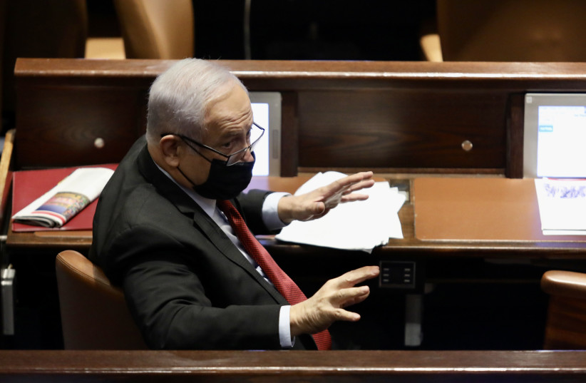  opposition head Benjamin Netanyahu at the Knesset plenum, December 15, 2021. (credit: MARC ISRAEL SELLEM/THE JERUSALEM POST)