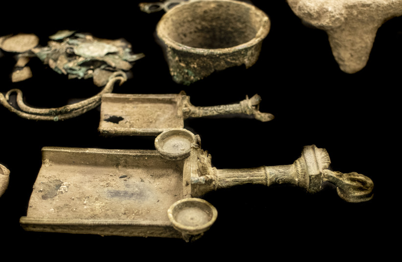  Bark Kokhba-era ornamental bronze censers used for burning incense seized by antiquity authorities on December 8th.  (credit: YOLI SCHWARTZ/ISRAEL ANTIQUITIES AUTHORITY)