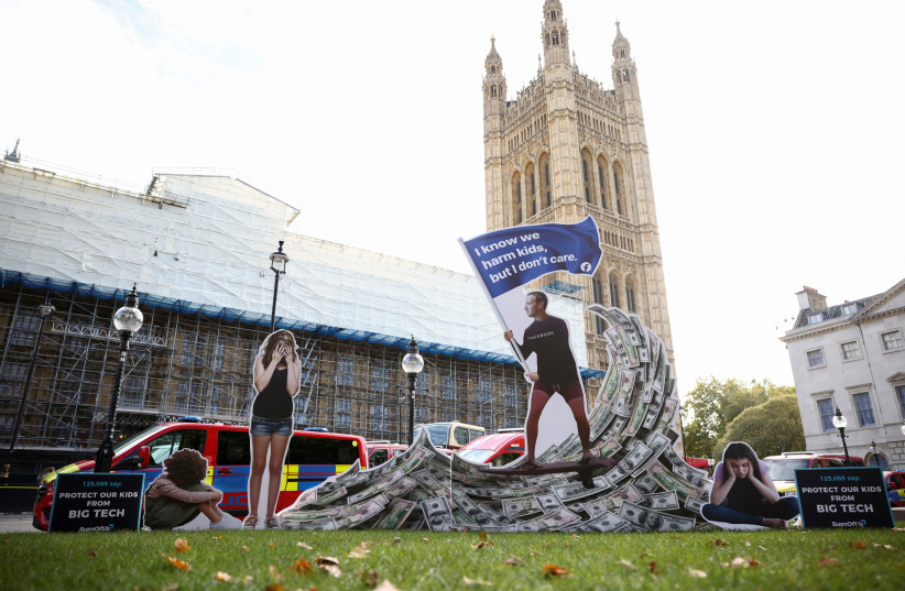  An installation in London depicting Mark Zuckerberg is displayed outside Parliament in October 2021. (photo credit: REUTERS/HENRY NICHOLLS)