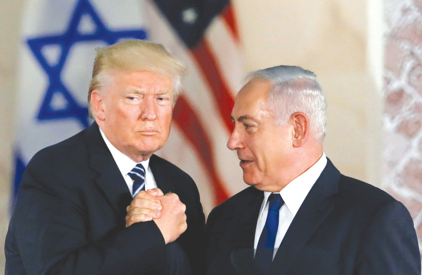  THEN-US President Donald Trump and then-prime minister Benjamin Netanyahu shake hands after Trump’s address at the Israel Museum in Jerusalem in 2017. (credit: RONEN ZVULUN/REUTERS)