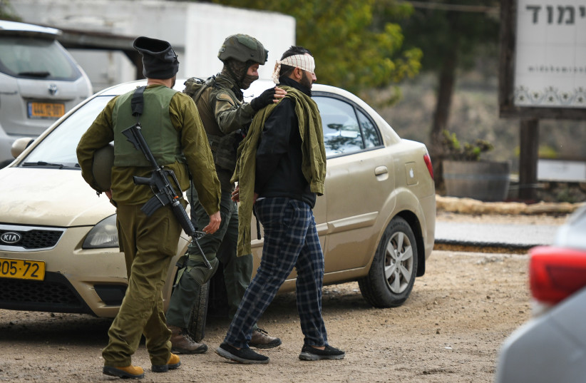  IDF arrest a Palestinian man outside Shavei Shomron, in the West Bank, on December 17, 2021, following the fatal shooting attack near Homesh that killed 25-year-old Yehuda Dimentman. (credit: SRAYA DIAMANT/FLASH90)