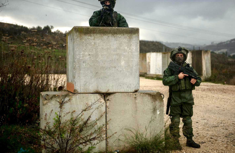  IDF soldiers are seen in the West Bank searching for the Palestinian gunmen behind the terrorist shooting in the Homesh settlement, on December 17, 2021. (photo credit: IDF SPOKESMAN’S UNIT)