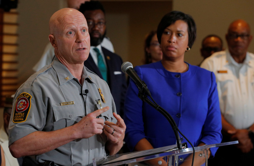 Washington DC Mayor Muriel Bowser and Fairfax County, Virginia Police Chief Ed Roessler answer questions from reporters about the city's preparations for the white nationalist-led rally marking the one year anniversary of 2017 Charlottesville 'Unite the Right' protests in Washington, US. (photo credit: REUTERS/BRIAN SNYDER)