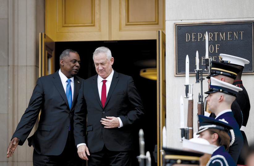 Defense Minister Benny Gantz arrives at the Pentagon as US Secretary of Defense Lloyd Austin welcomes him earlier this month. (credit: Carlos Barria/Reuters)