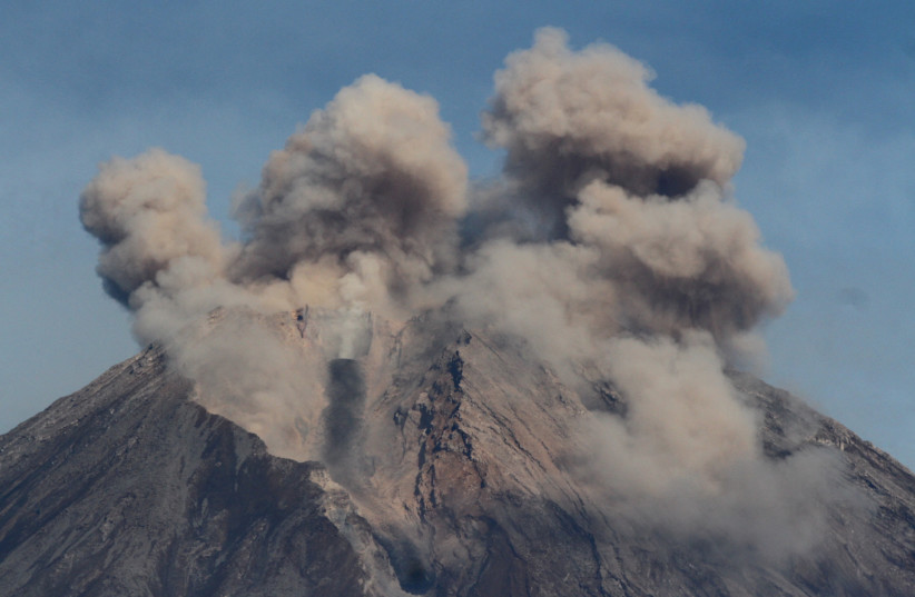  Mount Semeru volcano spews hot ash as seen from Pronojiwo district in Lumajang, East Java province, Indonesia, December 10, 2021, in this photo taken by Antara Foto. (photo credit: Antara Foto/Ari Bowo Sucipto/via REUTERS)