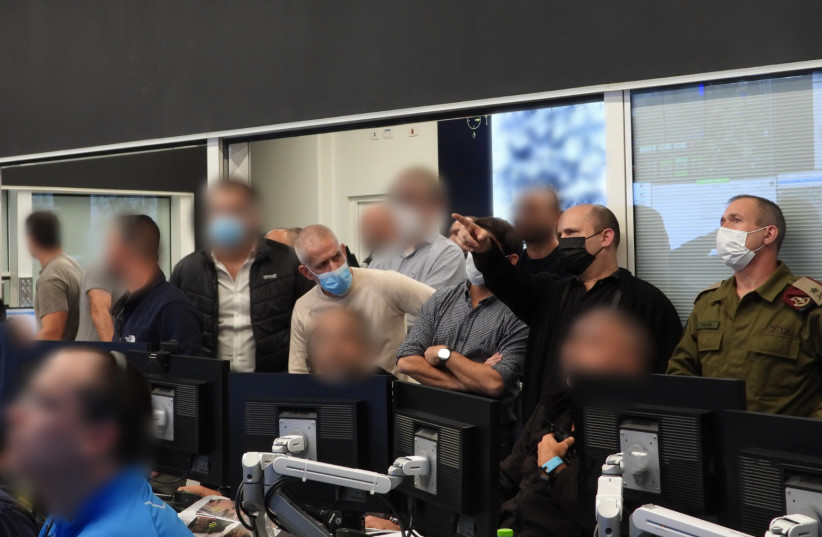  Prime Minister Naftali Bennett at the Shin Bet control room during the capture of the terrorists who killed Yehuda Dimentman, 25, December 19, 2021.  (photo credit: Courtesy)