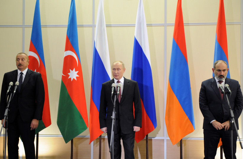 Russia's President Vladimir Putin, Armenia's Prime Minister Nikol Pashinyan and Azerbaijan's President Ilham Aliyev attend a news conference following their trilateral meeting in Sochi, Russia November 26, 2021. (credit: SPUTNIK/MIKHAIL KLIMENTYEV/KREMLIN VIA REUTERS)