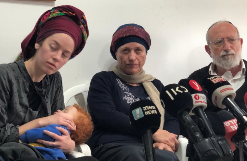  Yehuda Dimentman's widow Ethia and child (left) at a press conference. (credit: TOVAH LAZAROFF)