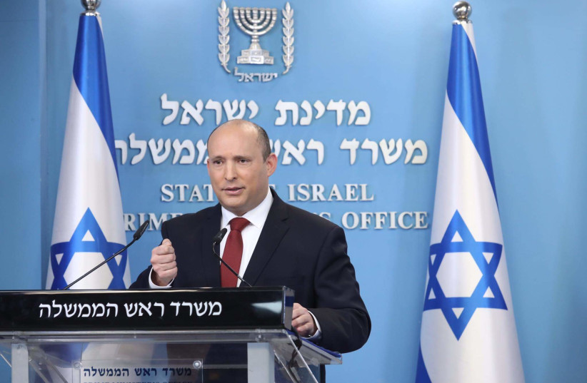  Prime Minister Naftali Bennett is seen holding a special press conference on COVID-19 in Jerusalem, on December 19, 2021. (photo credit: MARC ISRAEL SELLEM/THE JERUSALEM POST)