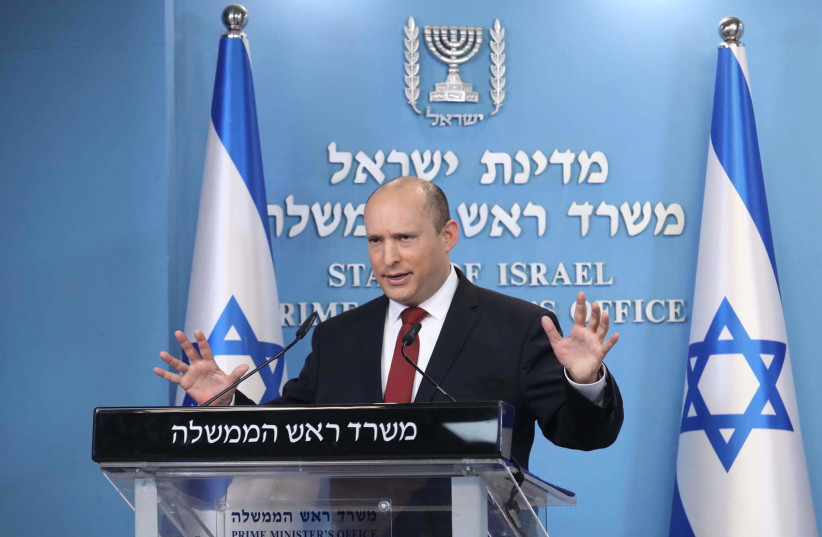  Prime Minister Naftali Bennett is seen holding a special press conference on COVID-19 in Jerusalem, on December 19, 2021. (credit: MARC ISRAEL SELLEM/THE JERUSALEM POST)
