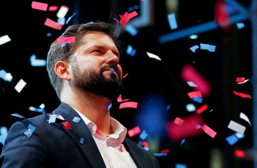  Chile's President-elect Gabriel Boric celebrates with supporters after winning the presidential election in Santiago, Chile, December 19, 2021 (photo credit: REUTERS/RODRIGO GARRIDO)