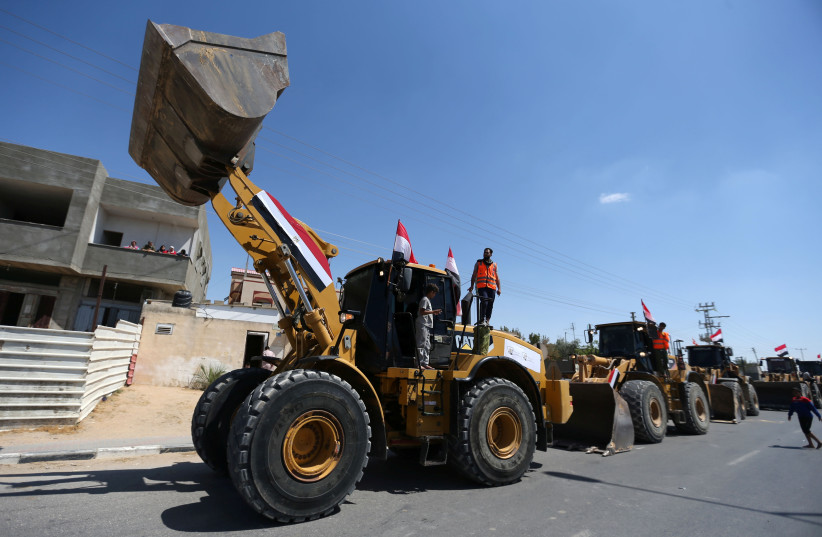  Egypt sends building equipment to Palestinians in Gaza Strip (credit: REUTERS/IBRAHEEM ABU MUSTAFA)