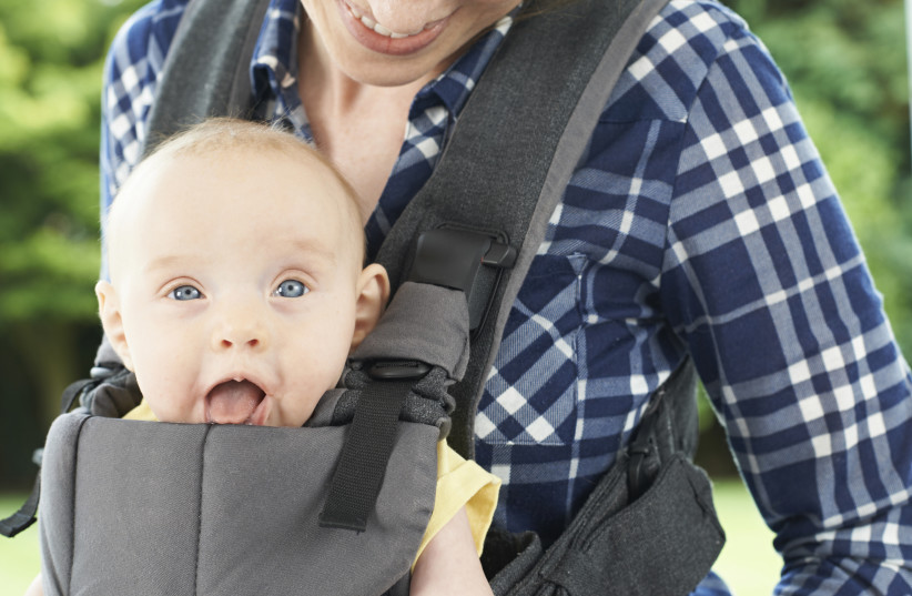  Baby in baby carrier (photo credit: INGIMAGE)
