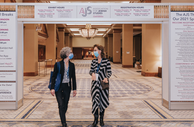  Scholars Beth Berkowitz (left) and Christine Hayes walk and talk during the 53rd Association of Jewish Studies Annual Conference, held at the Sheraton Grand Chicago, Dec. 19, 2021. (photo credit: JOE UNDERBAKKE VIA JTA)