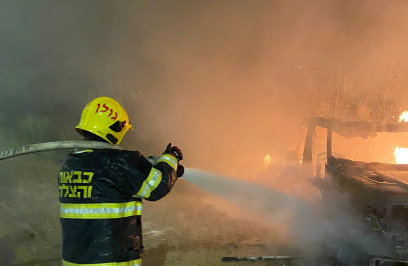  Israel Fire and Rescue Services firefighters in the aftermath of an attempted car ramming attack in the West Bank (photo credit: ISRAEL FIRE AND RESUCE SERVICES)
