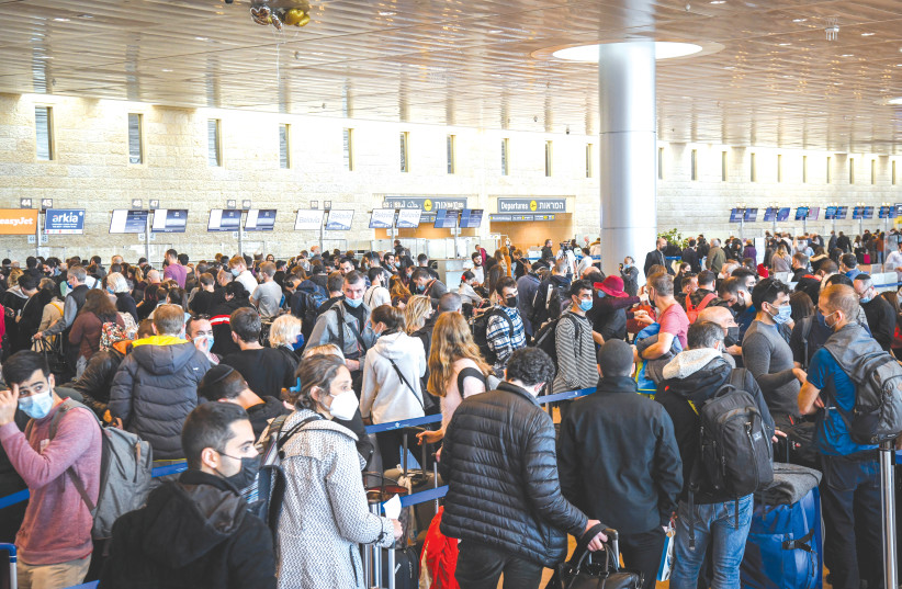 With more countries being declared ‘red,’ travelers converge on Ben-Gurion Airport on Sunday. (credit: FLASH90)