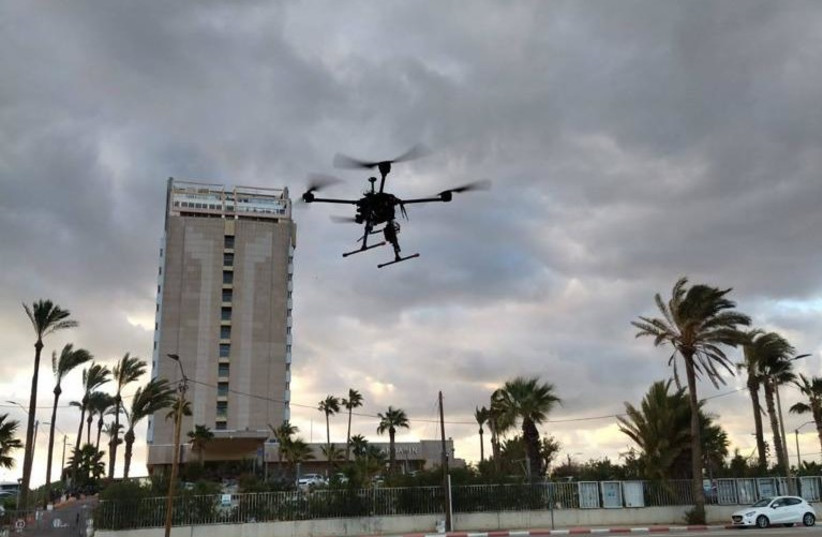  A drone is seen flying in Yerucham. (credit: Chen BarAm/HarTech)