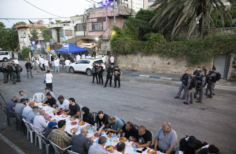  OREN ZIV’S visually and conceptually oxymoronic shot shows Arabs breaking their Ramadan daytime fast near homes in Sheikh Jarrah from which some were evicted. (credit: OREN ZIV)