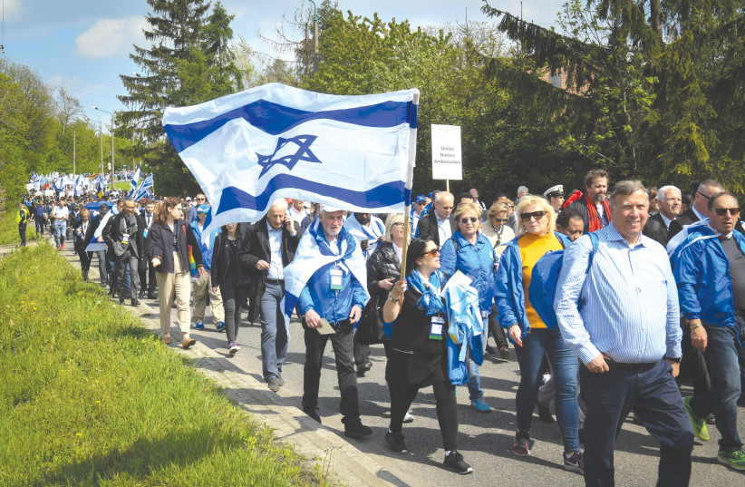  JEWISH YOUTH participating in the March of the Living at the Auschwitz-Birkenau camp site in Poland, in 2019. (credit: YOSSI ZELIGER/FLASH90)
