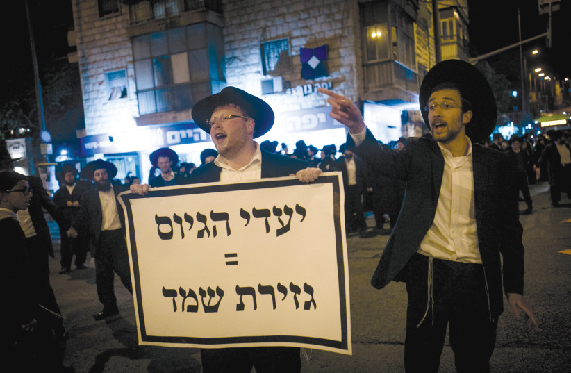  HAREDIM PROTEST at the city’s Bar Ilan intersection, following the arrest of a haredi draft-dodger. The Peleg faction frequently spearheads such protests; Illustrative.  (photo credit: YONATAN SINDEL/FLASH90)