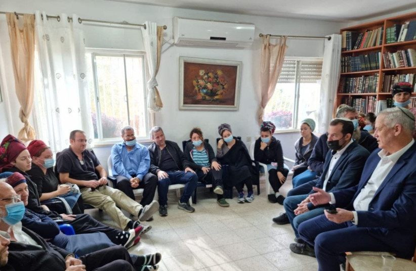  Defense Minister Benny Gantz is seen visiting the family of Yehuda Dimentman in Mevaseret Zion, where they are sitting shiva, on December 22, 2021. (photo credit: Berle Crombie )