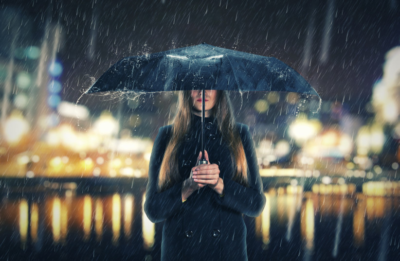  Woman in the rain (photo credit: INGIMAGE)