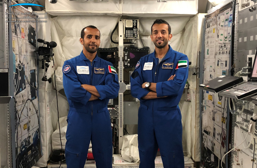  Emirati astronauts Hazzaa Al Mansoori (L) and Sultan Alneyad pose for a photo at The International Space Station (ISS) in Star city in Moscow, Russia June 17, 2019 (credit: VIA REUTERS)