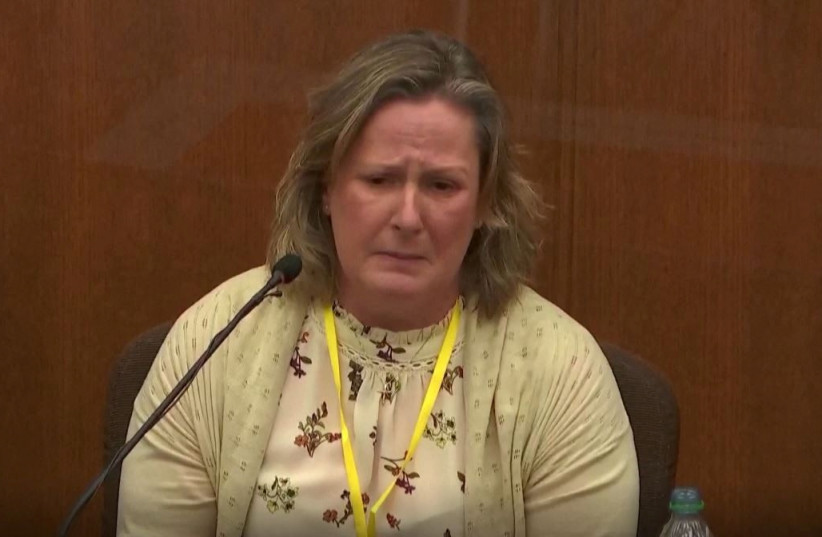 Kimberly Potter, the white former Minnesota police officer who killed Black motorist Daunte Wright in April after claiming she mistook her handgun for her Taser, breaks down in tears as she testifies during her trial in Brooklyn Center, Minnesota, US, December 17, 2021. (photo credit: POOL FOOTAGE/HANDOUT VIA REUTERS)