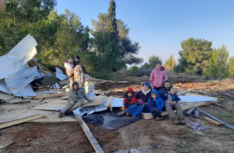  A family in the hilltop settlement of Homesh after the modular structures were taken down by police, December 24, 2021.  (photo credit: NACHALA)