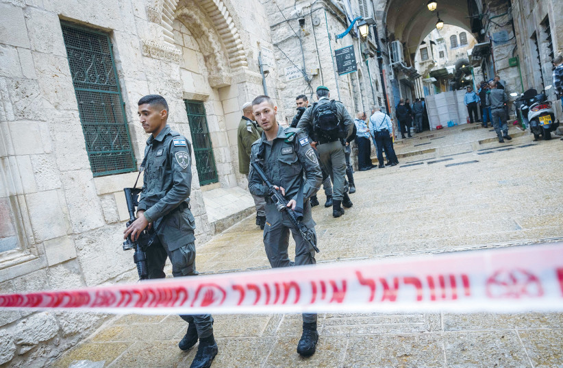  POLICE OFFICERS at the scene of a shooting and stabbing attack in Jerusalem’s Old City last November.  (photo credit: YONATAN SINDEL/FLASH 90)