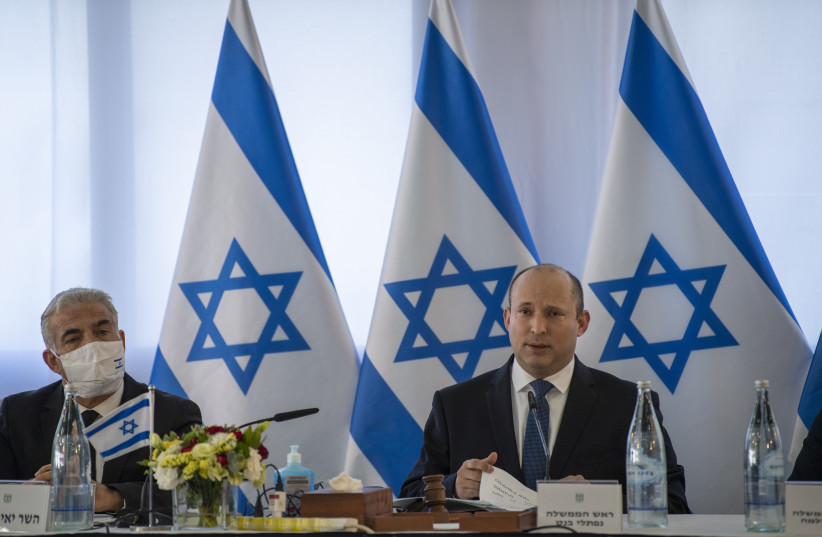  Prime Minister Naftali Bennett and alternate Prime Minister Yair Lapid at a meeting at Mevo Hama on Golan development. (credit: GIL ELIYAHU/HAARETZ/POOL)