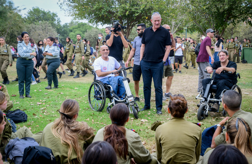  Israeli Minister of Defense Benny Gantz, Israeli soldiers and Israeli veterans and disabled IDF soldiers seen during a march honoring IDF wounded and disabled IDF, in Tel Aviv, November 17, 2021 (credit: AVSHALOM SASSONI/FLASH90)