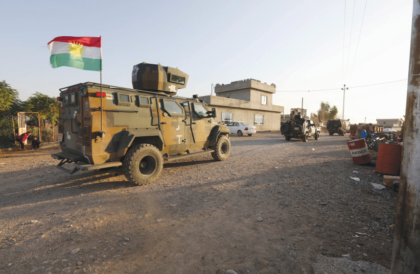Iraqi forces and Kurdish Peshmerga fighters deploy in an intensive security operation earlier this month to regain control over Luhaiban village in Kirkuk after Islamic State had seized the Iraqi village. (photo credit: AKO RASHEED/REUTERS)